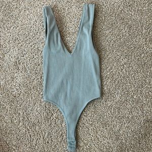 Low cut bodysuit very soft worn once